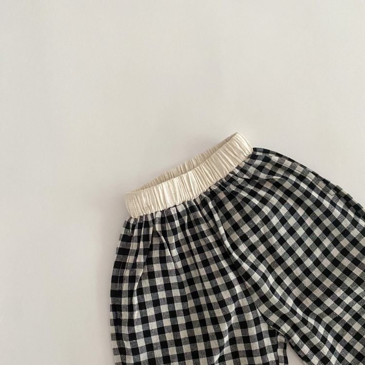 Baby girl long pants featuring a plaid pattern and lace design, perfect for spring and summer wear.