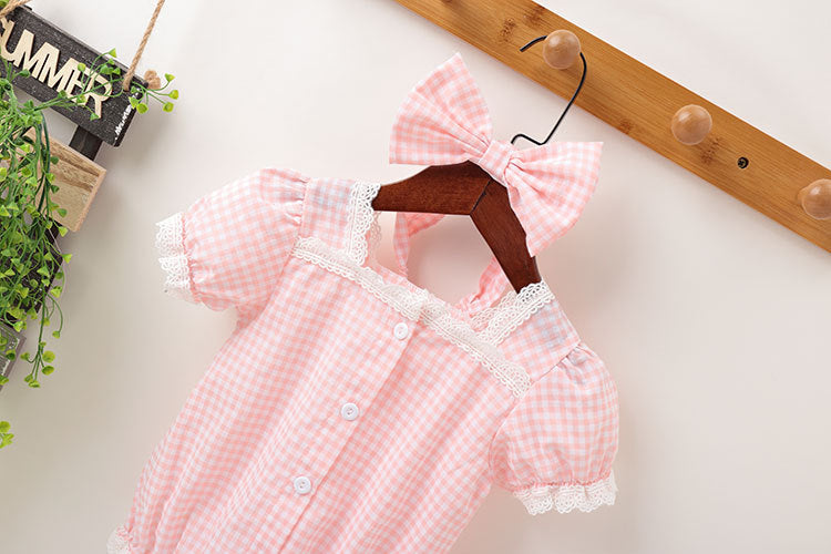 Baby girl plaid pattern onesie with lace patchwork design, short sleeves, and button-down closure in pink color.