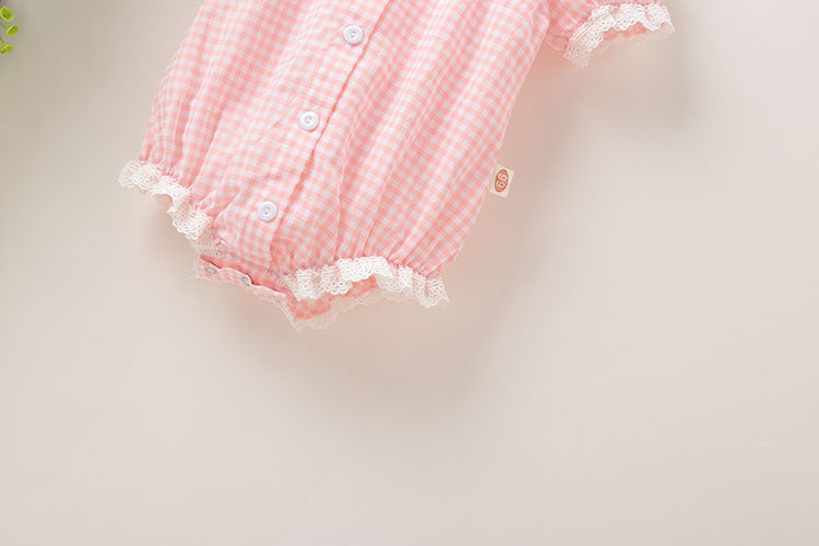 Baby girl plaid pattern onesie with lace patchwork design, short sleeves, and button-down closure in pink color.