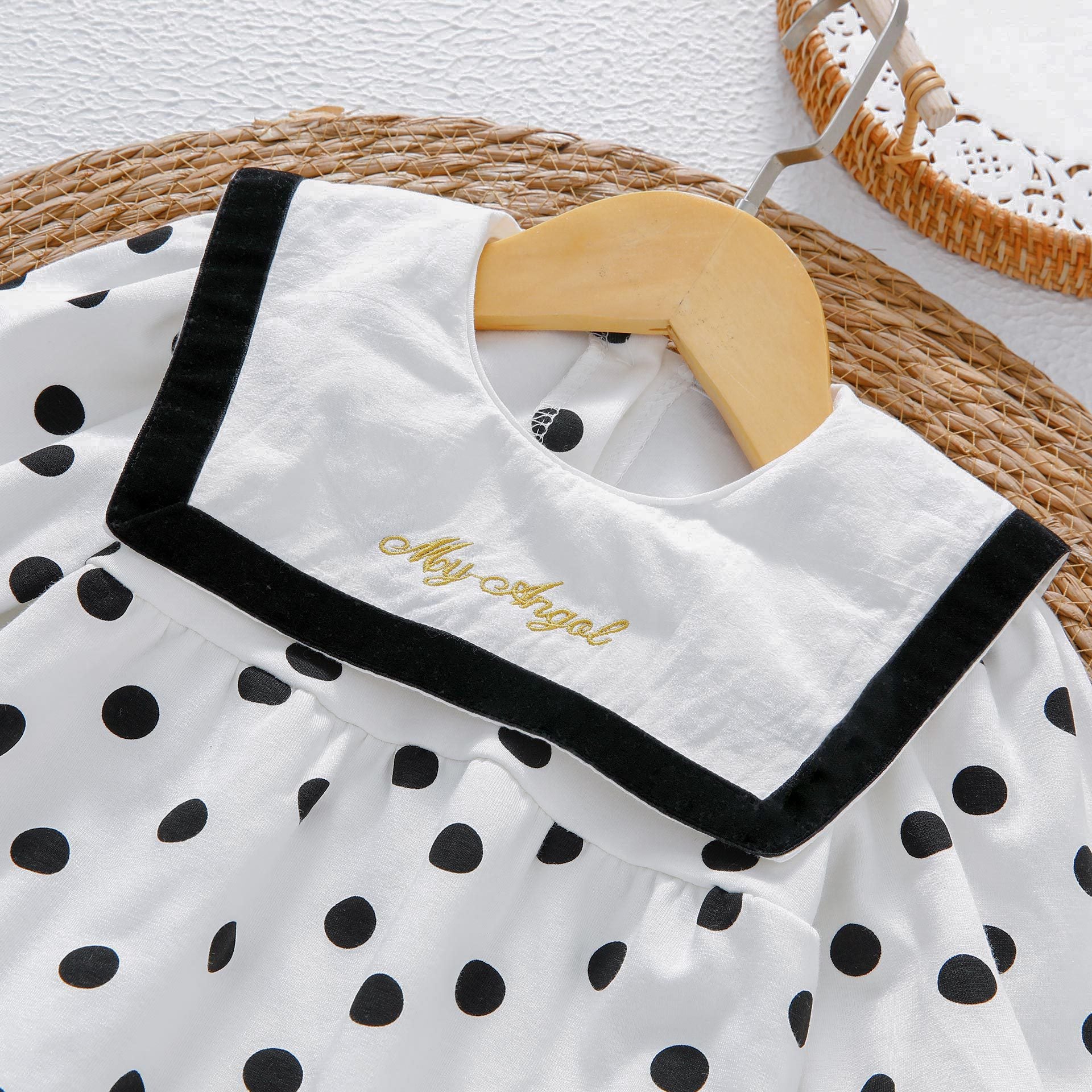 Baby girl bodysuit featuring a polka dot pattern and sailor collar design, made from soft cotton, perfect for spring and autumn.