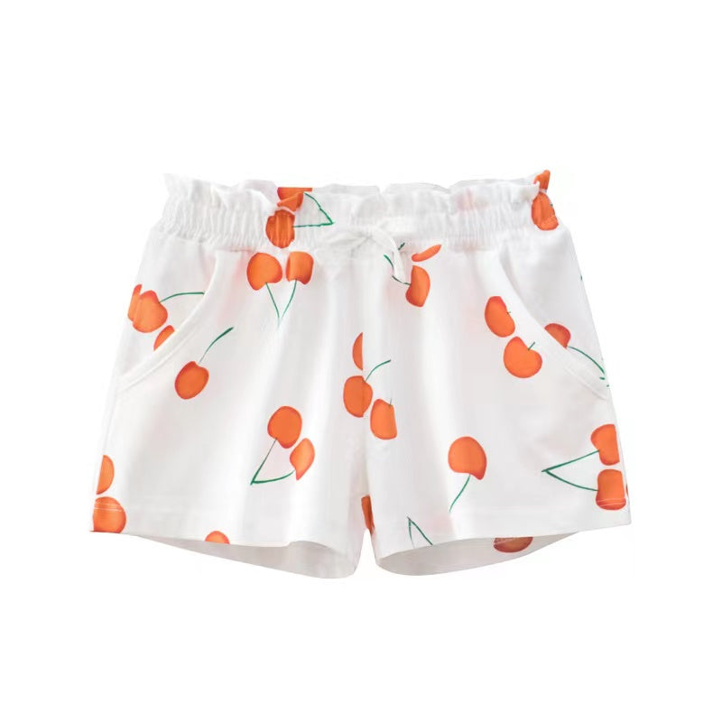 Baby girl summer shorts with vibrant print patterns and bow decoration, available in multiple colors.