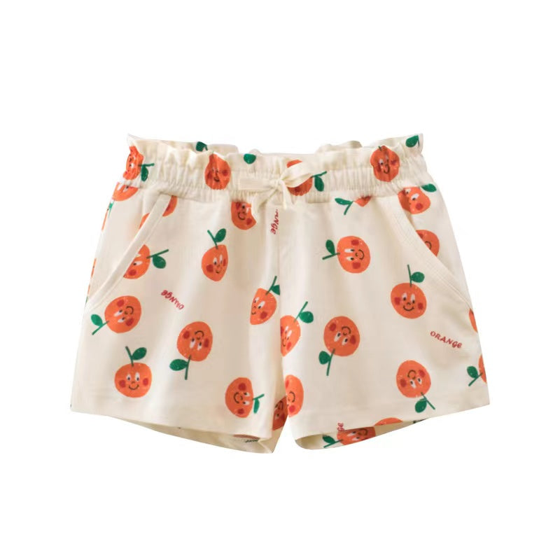 Baby girl summer shorts with vibrant print patterns and bow decoration, available in multiple colors.