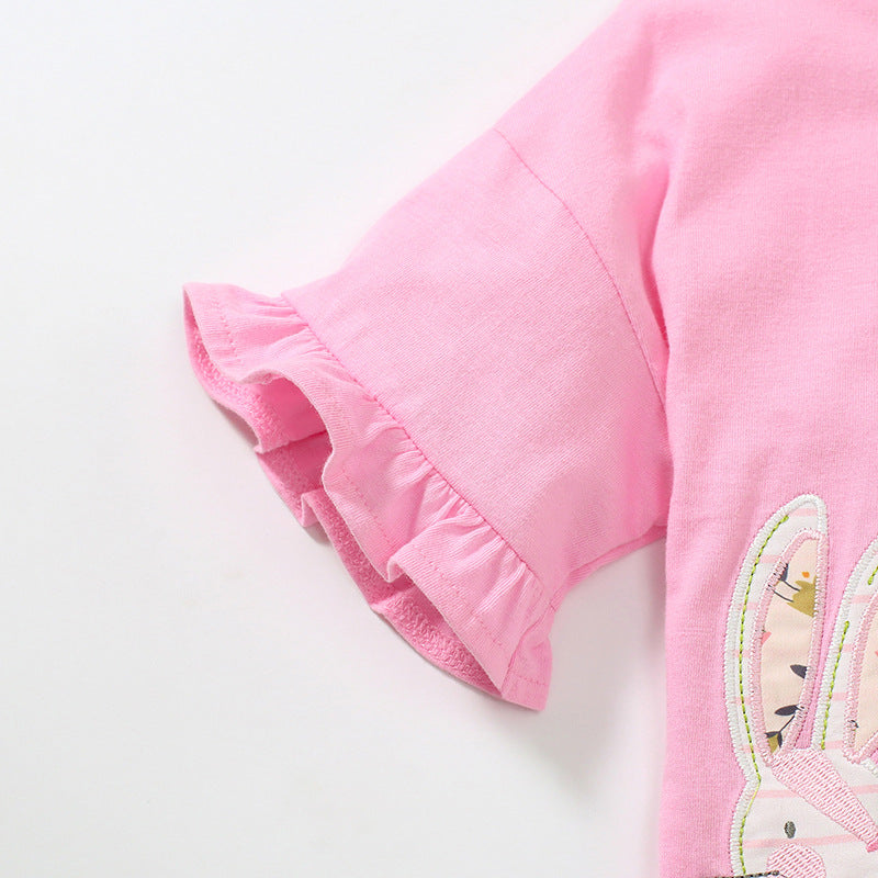 Baby girl wearing a pink cotton top with rabbit cartoon and floral ruffles, perfect for summer.