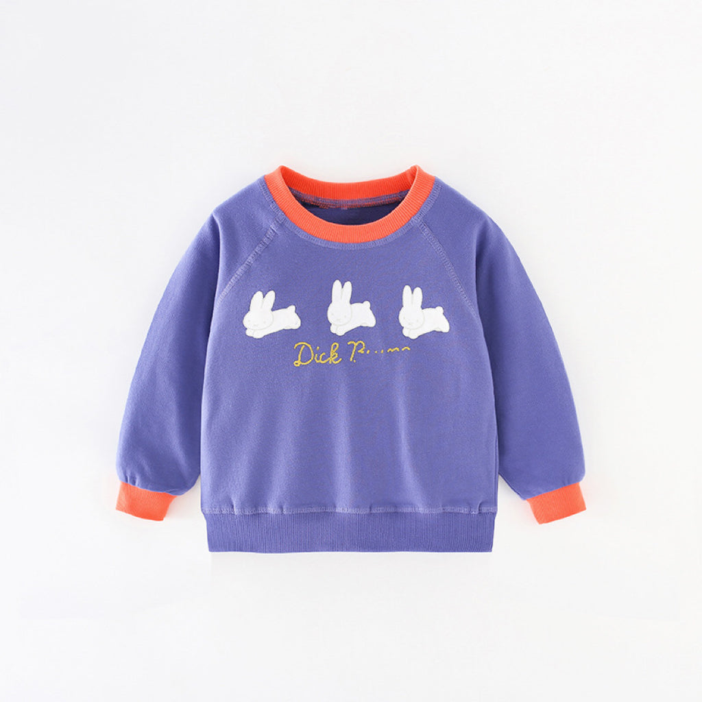 Baby girl wearing a blue rabbit print hoodie with colorblock design, showcasing a playful and stylish look.