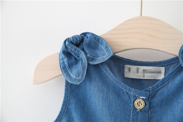 A stylish baby girl solid blue denim dress made from breathable cotton, perfect for summer wear.