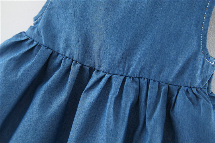 A stylish baby girl solid blue denim dress made from breathable cotton, perfect for summer wear.