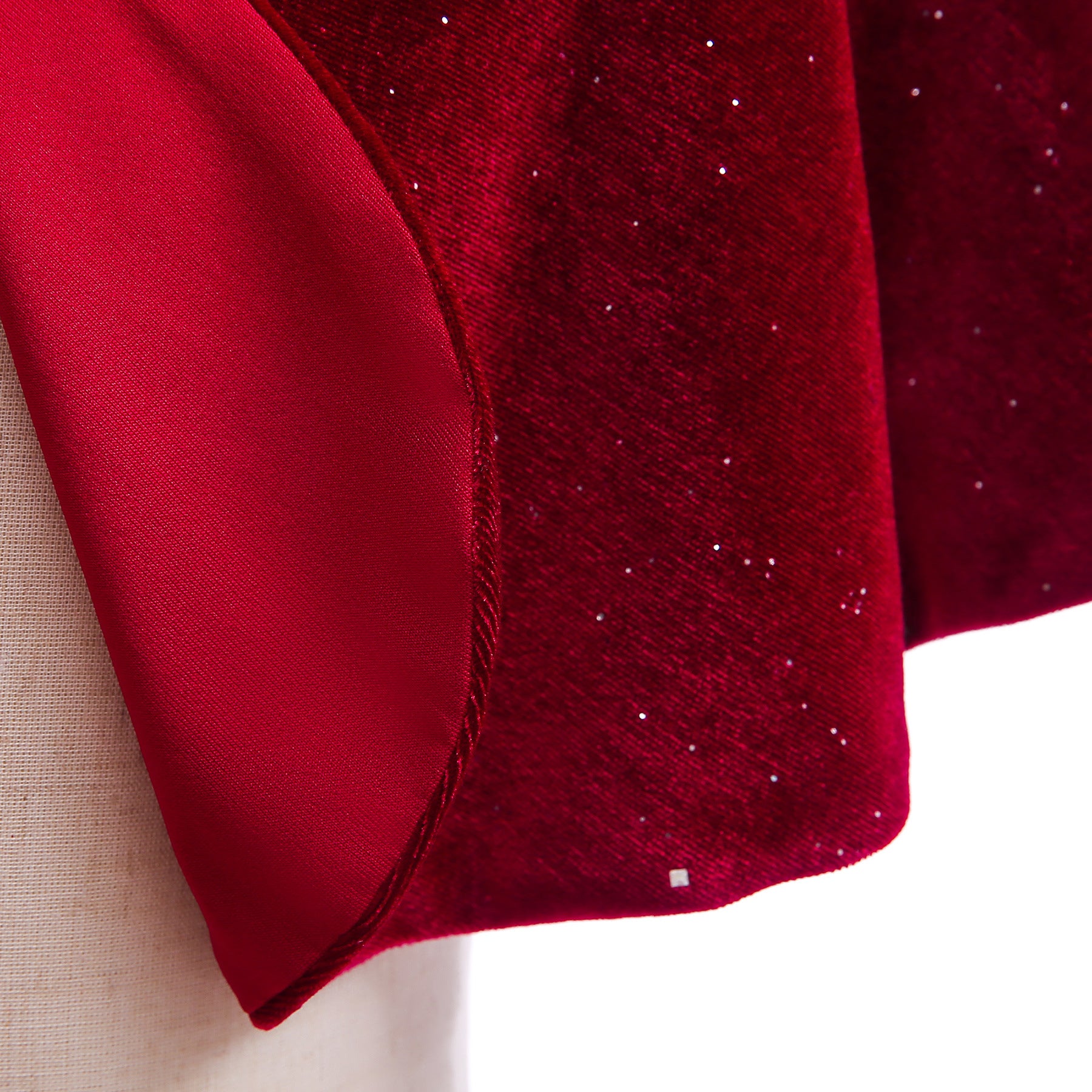 A beautiful red shawl cape for baby girls, featuring a delicate bow detail, perfect for Christmas parties and winter wear.