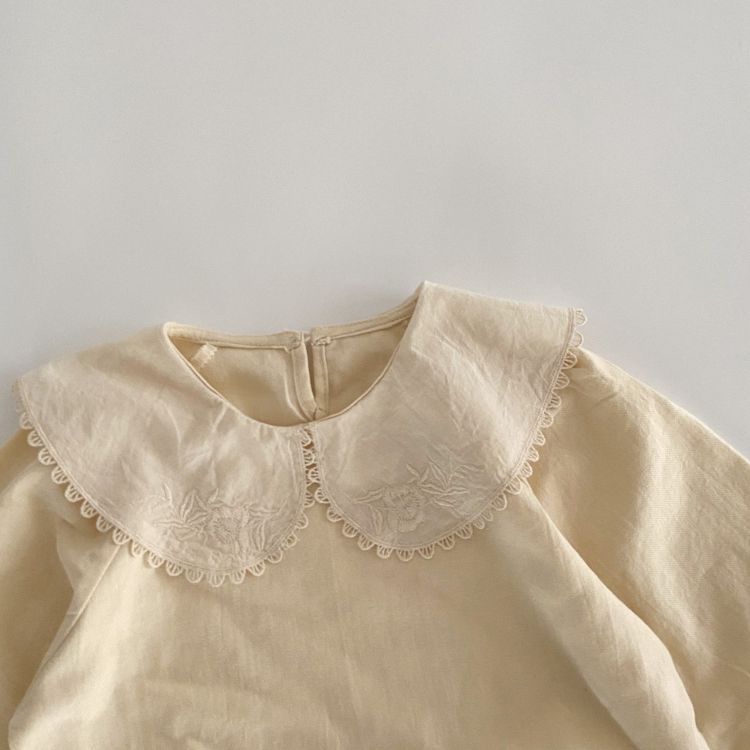 Baby Girl Solid Color Embroidered Pattern Doll-Neck Tops Shirt in beige with colorful embroidery, perfect for stylish young girls.