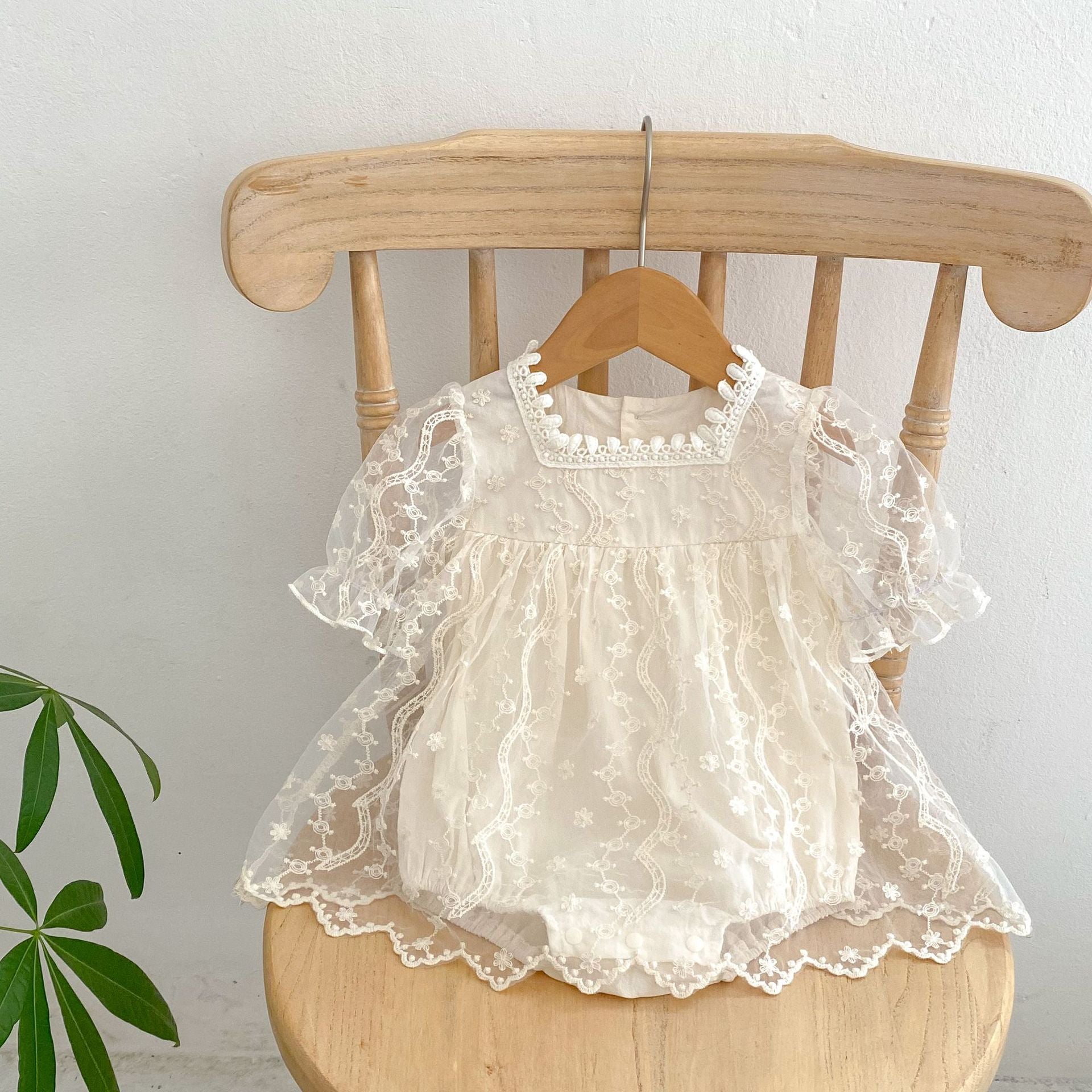 Baby girl dress featuring solid color, floral embroidery, and mesh design, perfect for summer occasions.