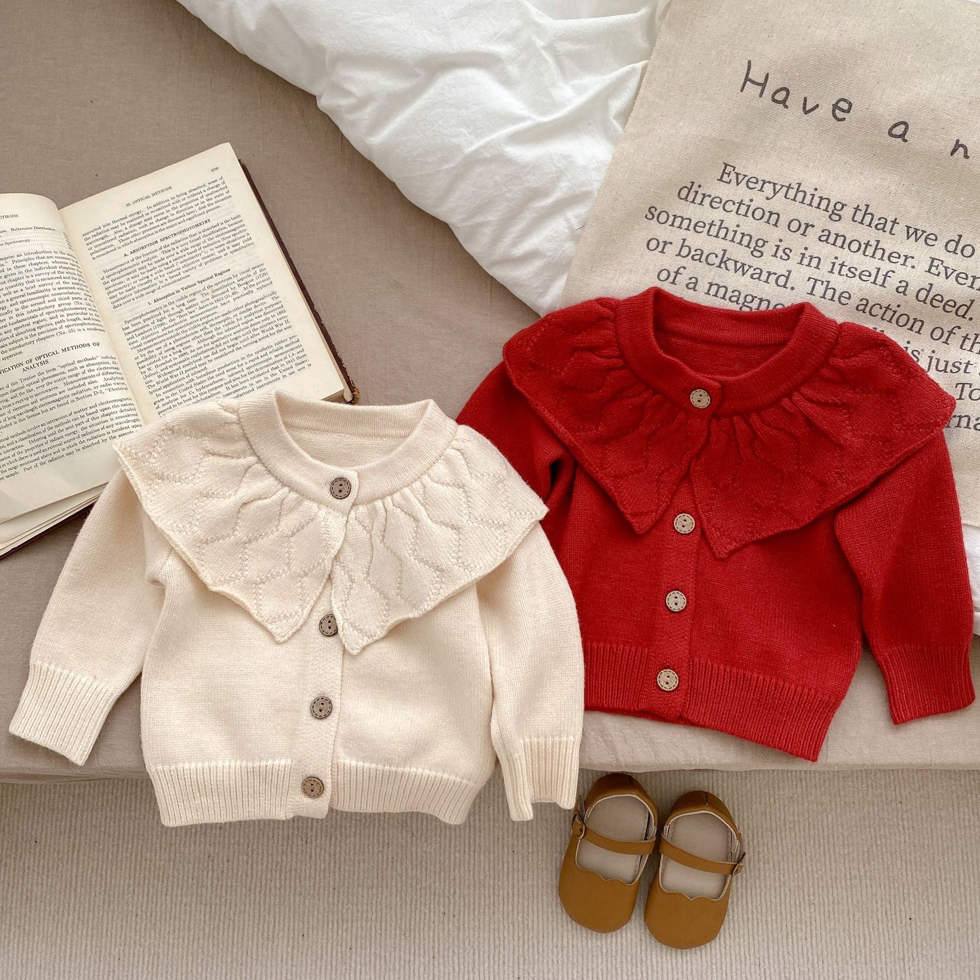 Baby girl solid color knit cardigan with lapel design in white and red, made from soft cotton fabric.