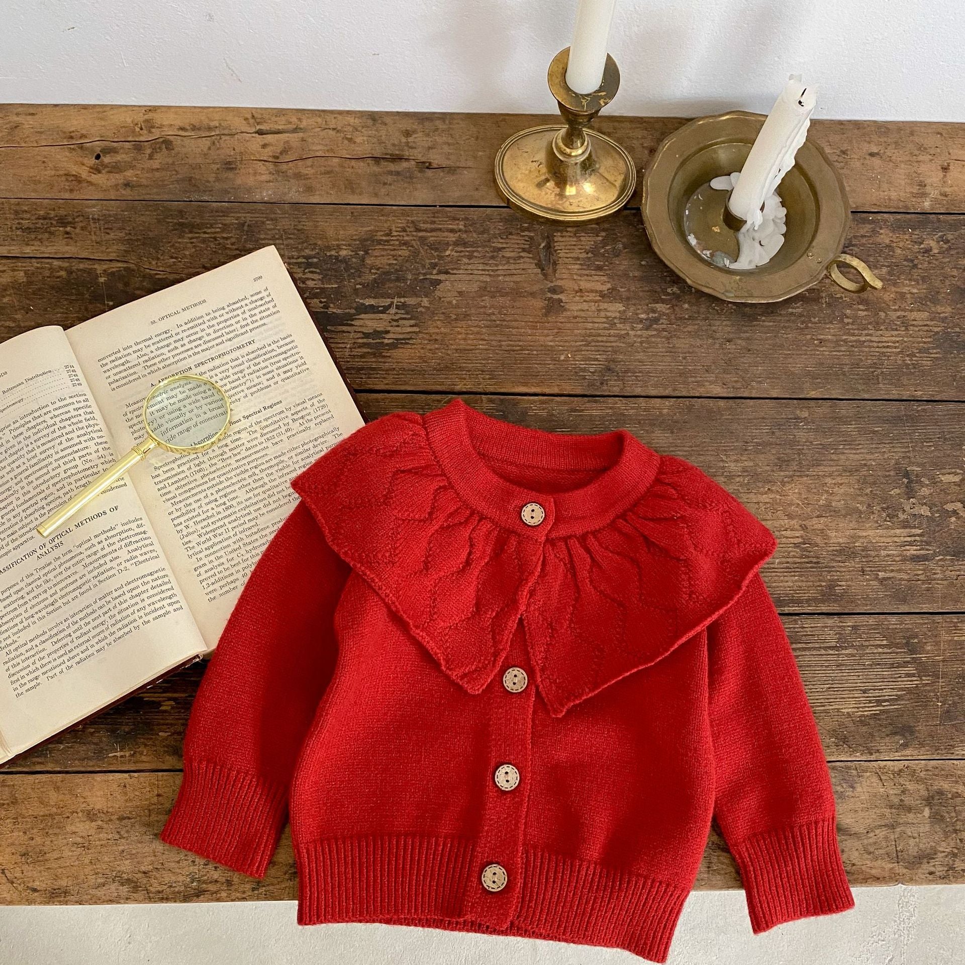 Baby girl solid color knit cardigan with lapel design in white and red, made from soft cotton fabric.