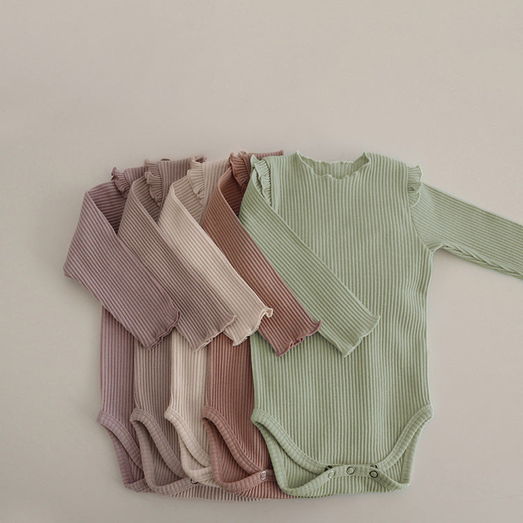 Baby girl long sleeve bodysuit in solid colors with lettuce trim design, showcasing comfort and style.