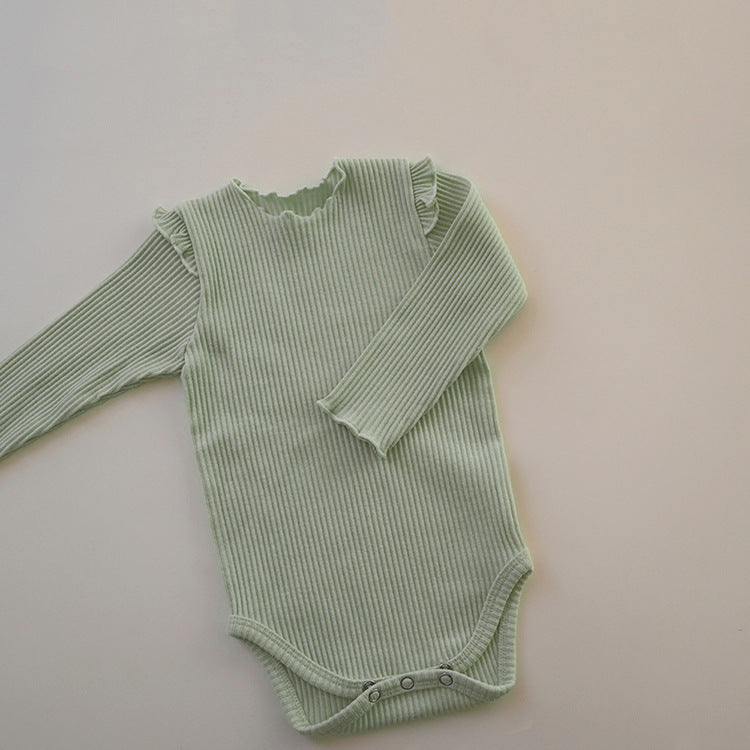 Baby girl long sleeve bodysuit in solid colors with lettuce trim design, showcasing comfort and style.