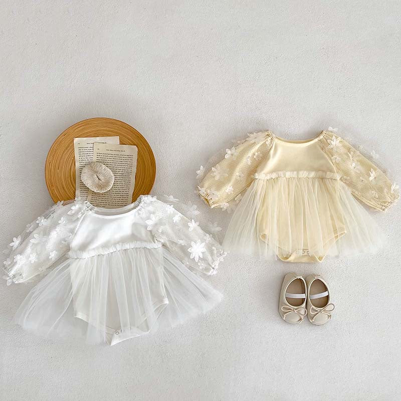 Baby girl dress in solid colors with mesh patches, available in white and apricot, made from soft cotton fabric.