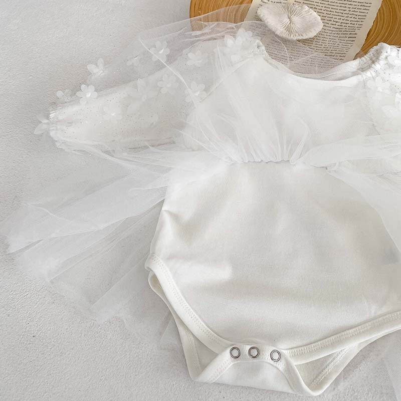 Baby girl dress in solid colors with mesh patches, available in white and apricot, made from soft cotton fabric.