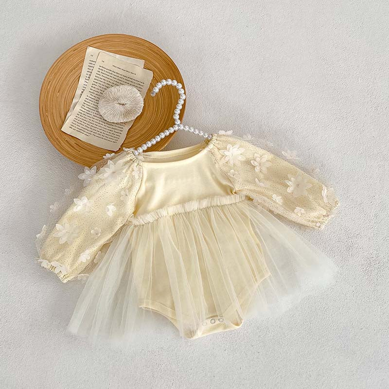 Baby girl dress in solid colors with mesh patches, available in white and apricot, made from soft cotton fabric.