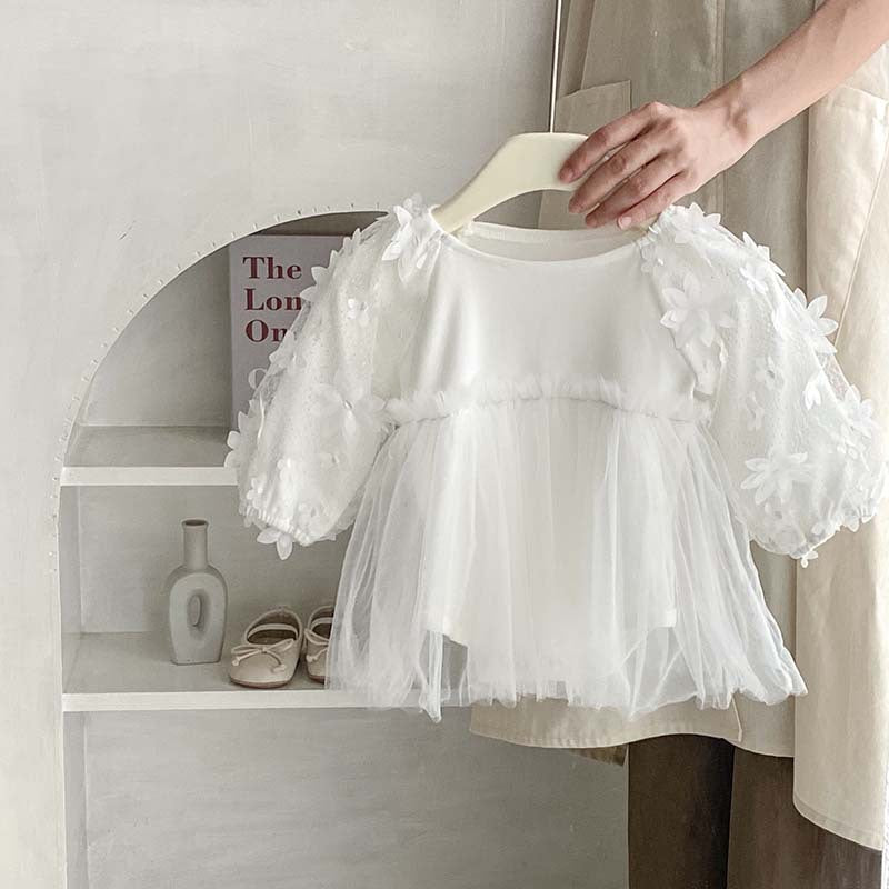 Baby girl dress in solid colors with mesh patches, available in white and apricot, made from soft cotton fabric.