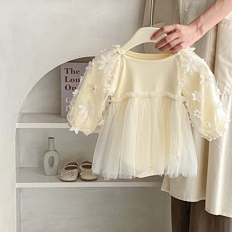 Baby girl dress in solid colors with mesh patches, available in white and apricot, made from soft cotton fabric.