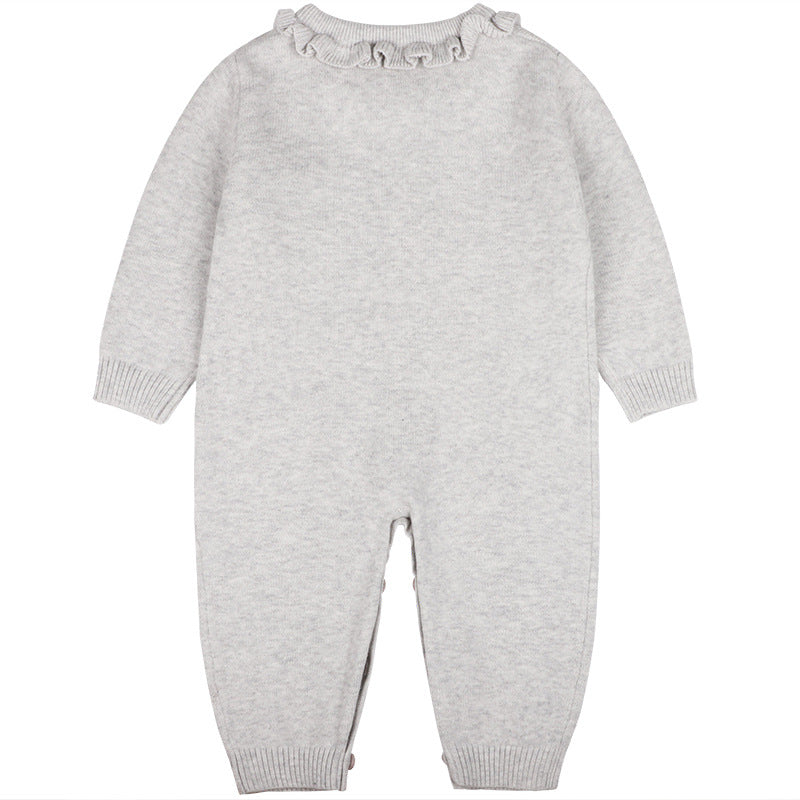 Baby girl wearing a stylish grey solid color ruffle collar jumpsuit with long sleeves, showcasing comfort and chic design.