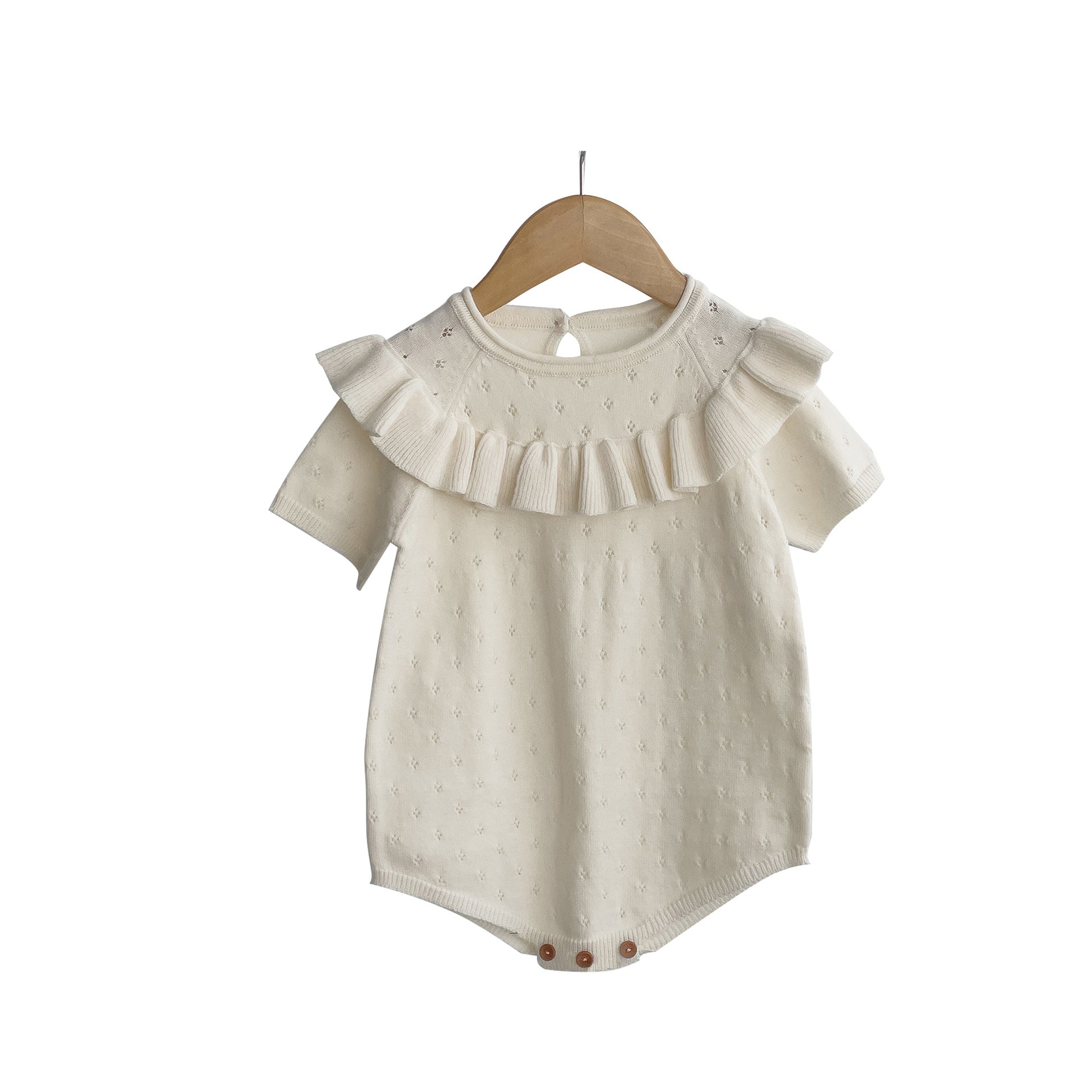 Baby girl solid color knitted onesies with ruffle design in white and pink, made from breathable cotton.