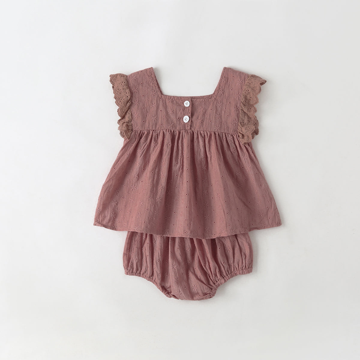 Baby girl wearing a solid color ruffle design square neck top in white, showcasing a stylish and comfortable summer outfit.