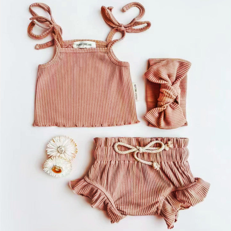 Baby Girl Solid Color Sling Triangle Shorts Set in white, pink, and grey, showcasing soft cotton fabric and adjustable straps.