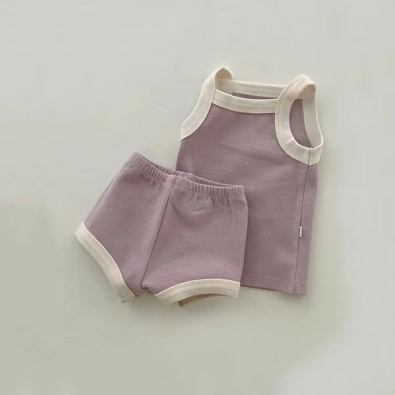 A stylish 2-piece baby girl outfit featuring a pure cotton vest and shorts in vibrant colors, perfect for summer wear.