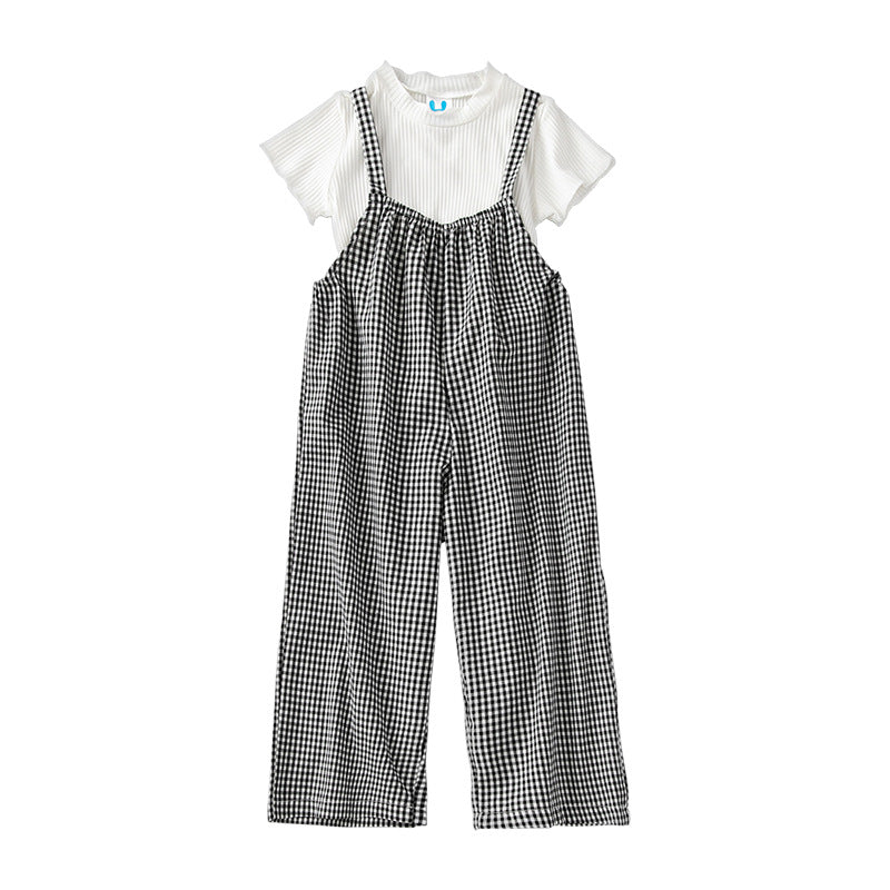 A stylish 2-piece set for baby girls featuring a solid color top and plaid pattern overalls in black, perfect for summer wear.