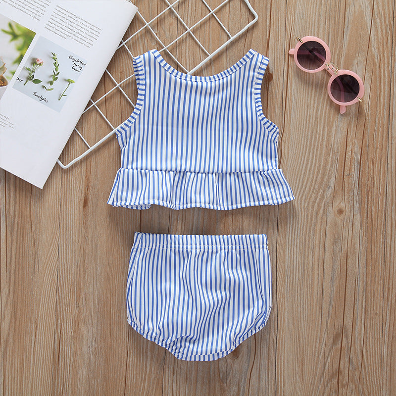 Baby girl striped graphic swimsuit with ruffle top and shorts, available in pink and blue.