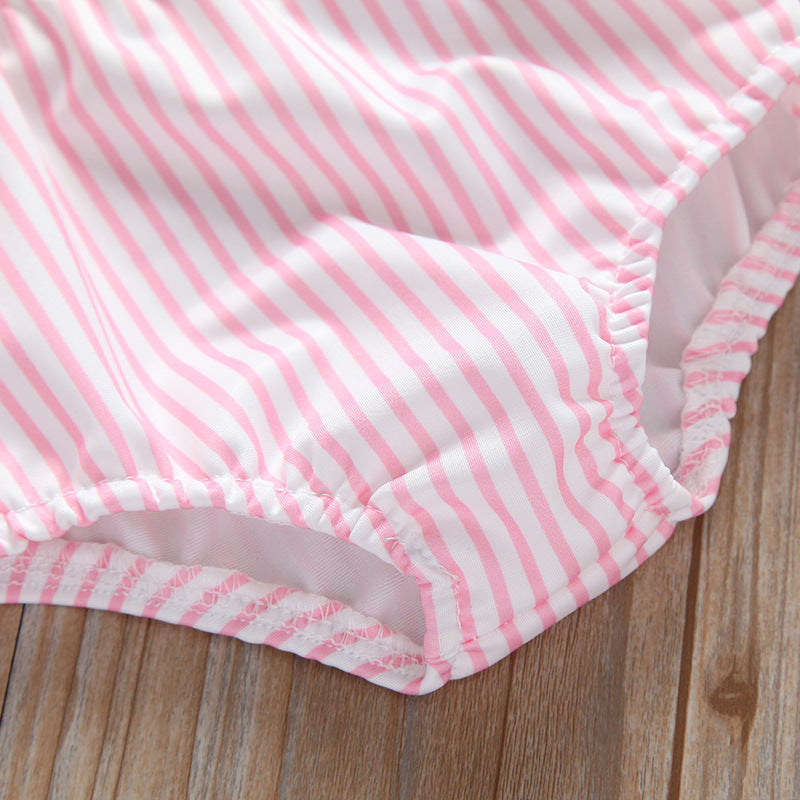 Baby girl striped graphic swimsuit with ruffle top and shorts, available in pink and blue.