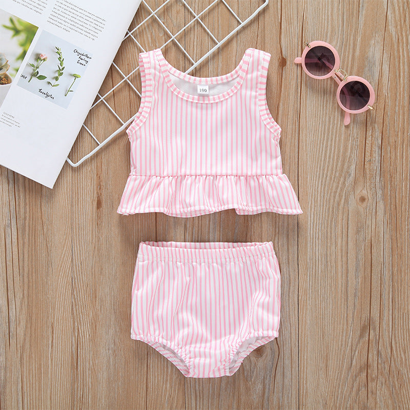 Baby girl striped graphic swimsuit with ruffle top and shorts, available in pink and blue.