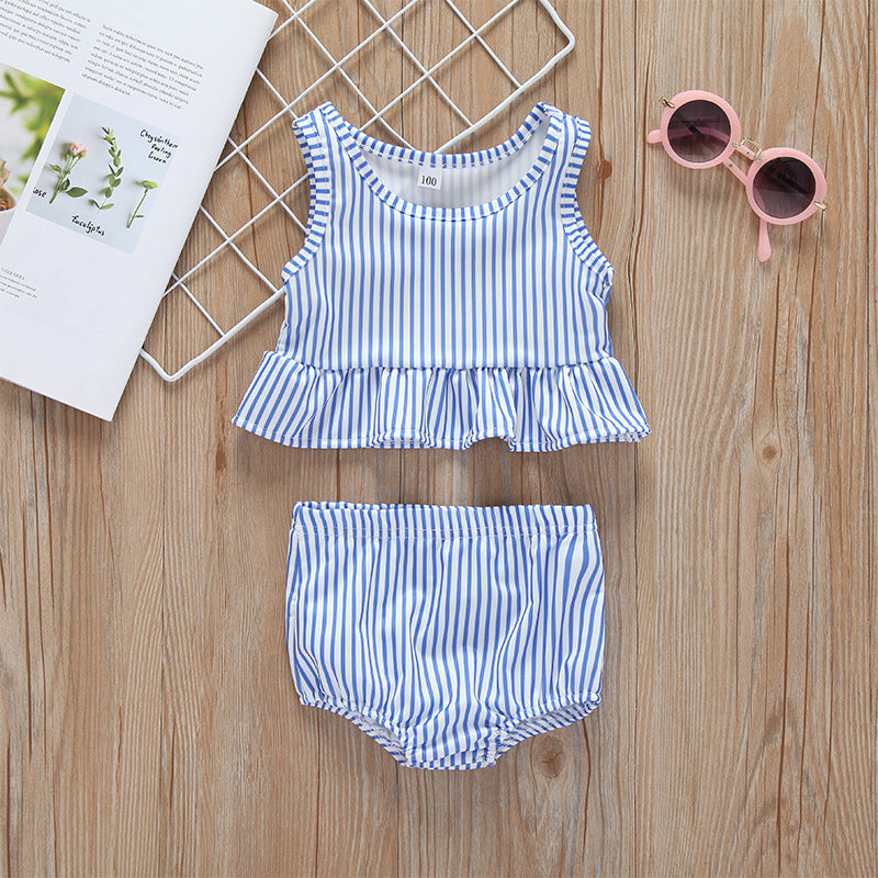 Baby girl striped graphic swimsuit with ruffle top and shorts, available in pink and blue.