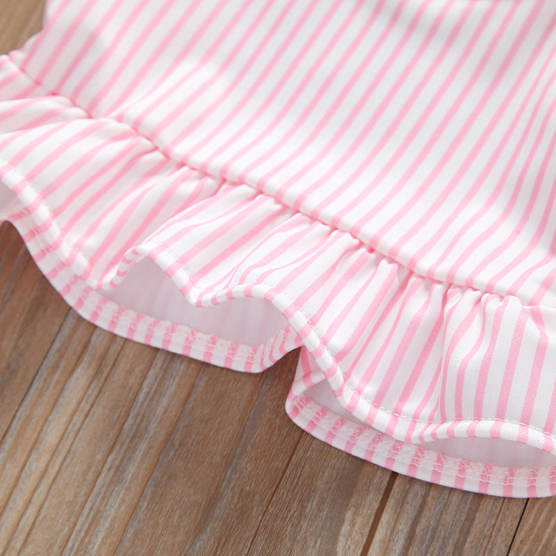 Baby girl striped graphic swimsuit with ruffle top and shorts, available in pink and blue.