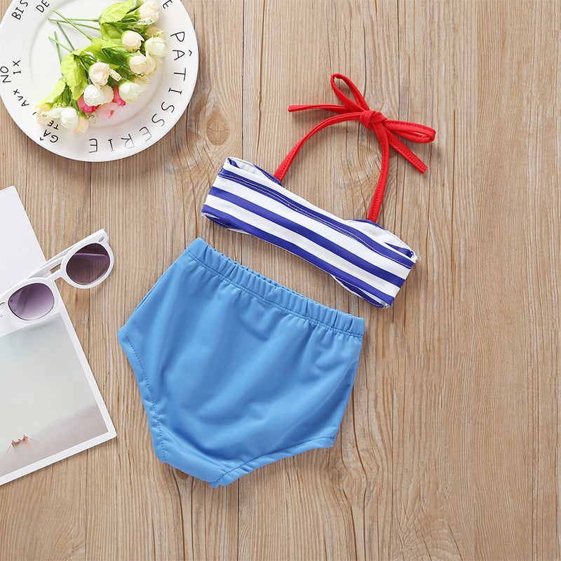 Baby girl wearing a stylish striped pattern bow tie design belted top with matching shorts, perfect for summer outings.