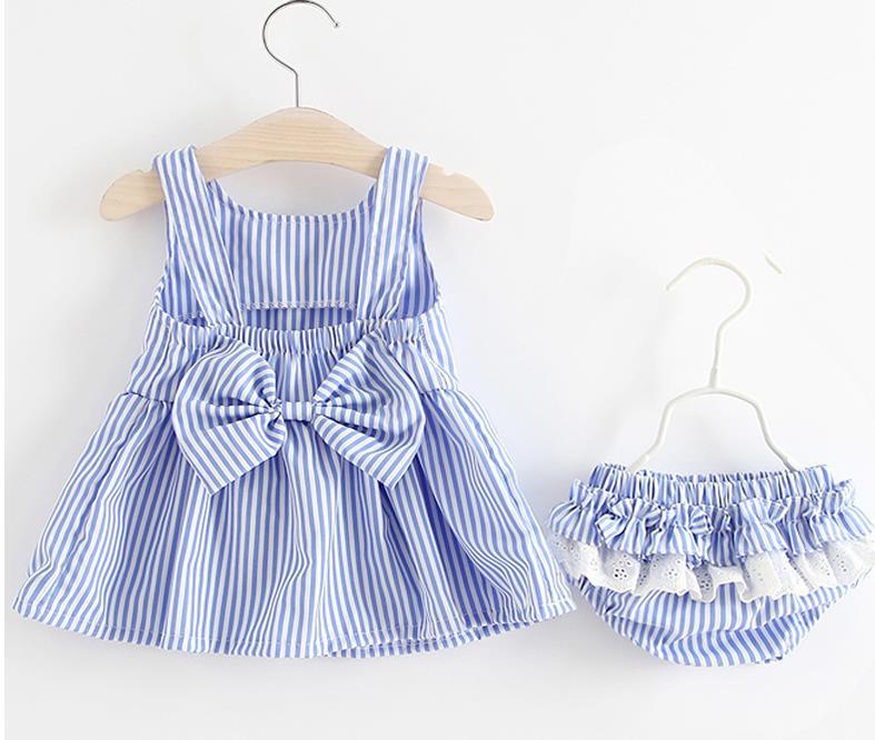 Baby girl wearing a striped pattern dress combo with shorts, showcasing a playful and stylish summer outfit in pink and blue.