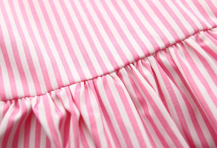 Baby girl wearing a striped pattern dress combo with shorts, showcasing a playful and stylish summer outfit in pink and blue.