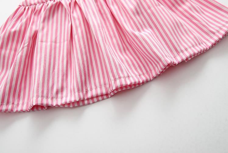 Baby girl wearing a striped pattern dress combo with shorts, showcasing a playful and stylish summer outfit in pink and blue.