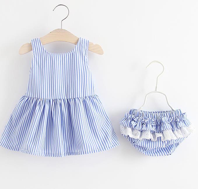 Baby girl wearing a striped pattern dress combo with shorts, showcasing a playful and stylish summer outfit in pink and blue.