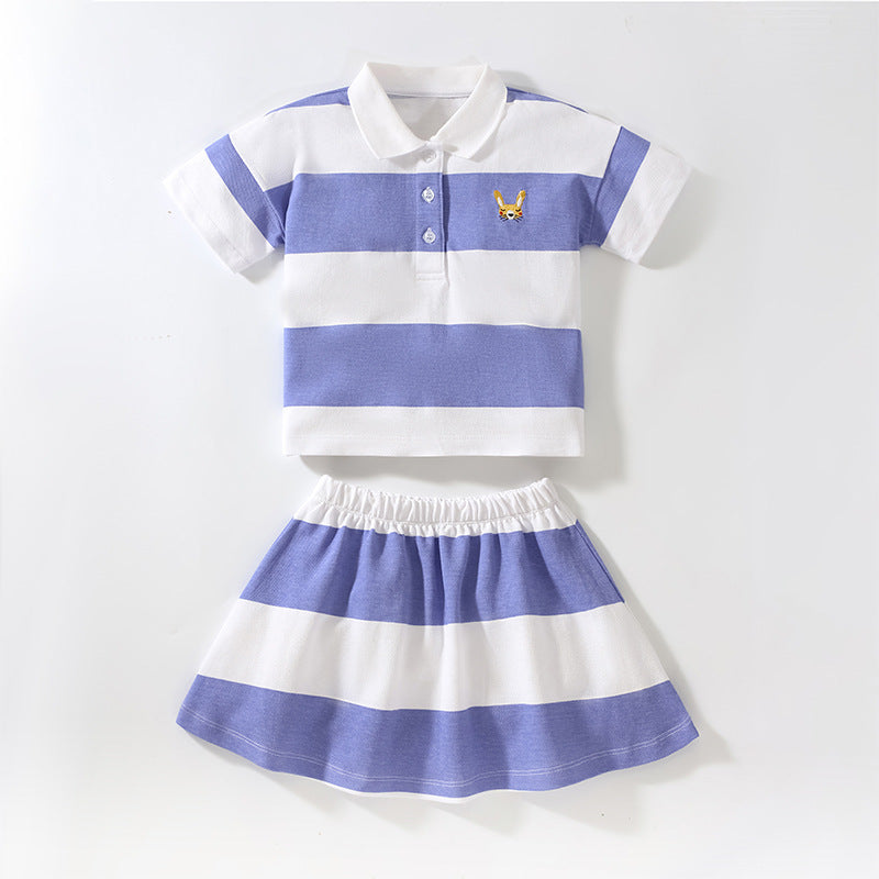 Baby girl wearing a blue striped polo neck shirt with a pleated skirt, perfect for summer outings.