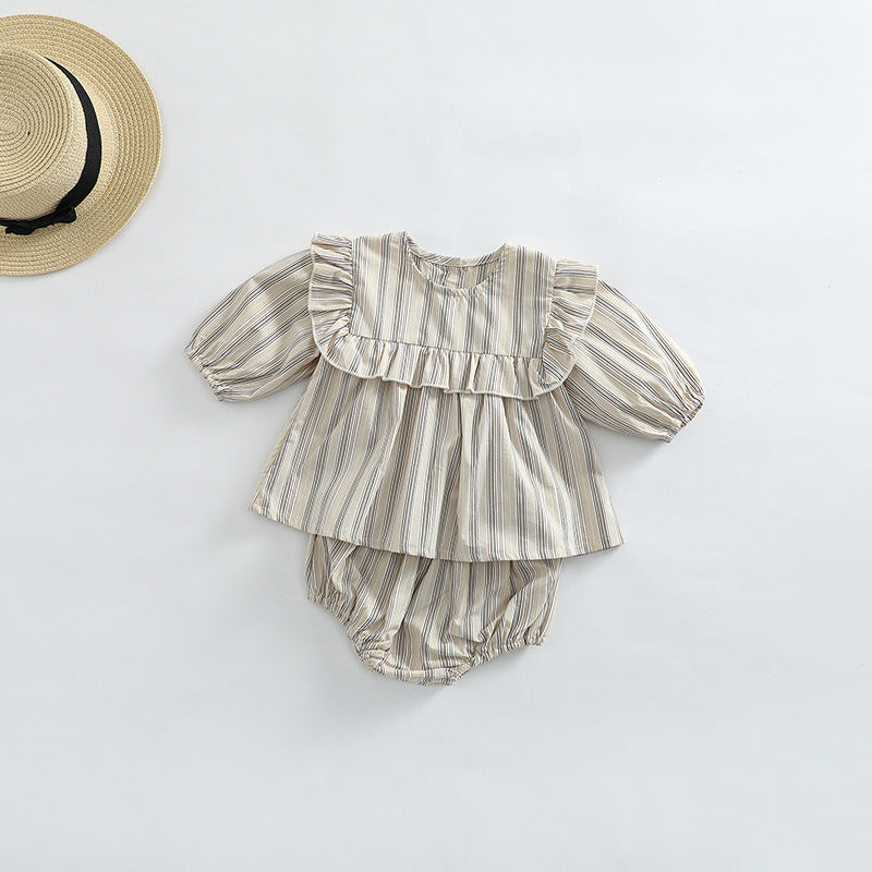 Baby girl wearing a striped pattern shirt and shorts combo set in blue, perfect for spring and autumn.