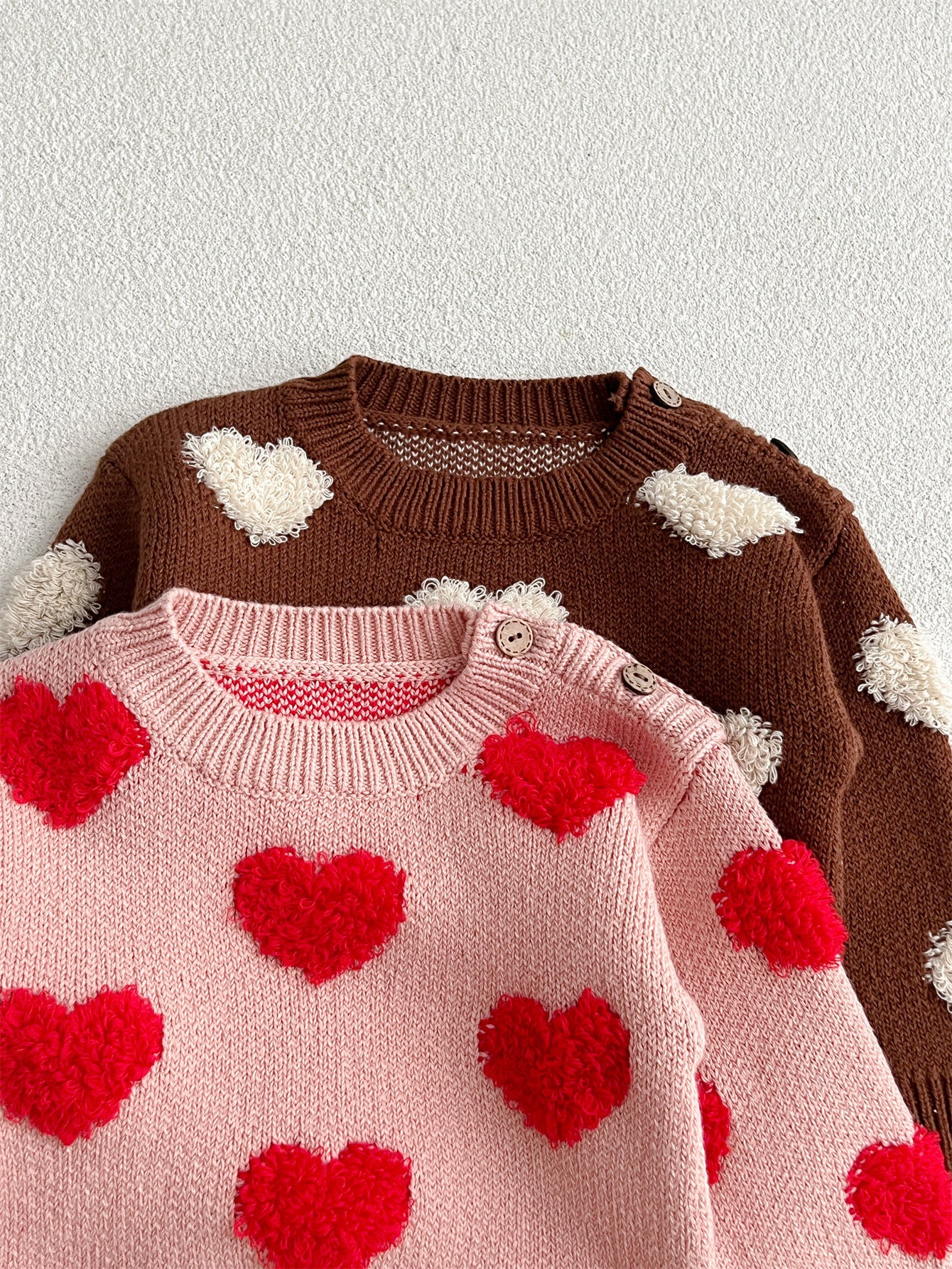 Baby girl long sleeve pullover sweater in pink and coffee with heart pattern, perfect for spring, autumn, and winter.