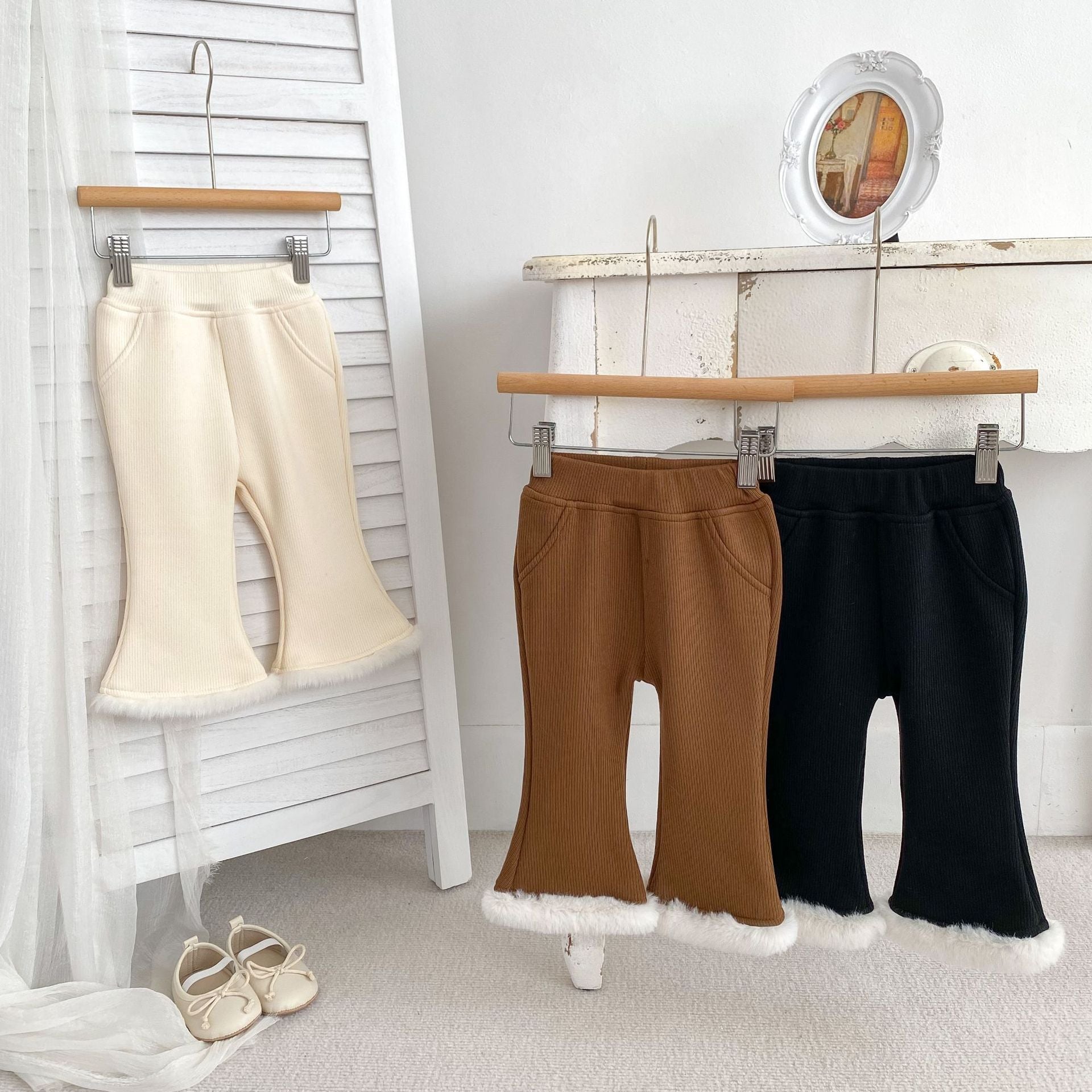 Baby girl velvet-in solid winter pants in black, beige, and brown colors, showcasing soft fabric and elastic waistband.