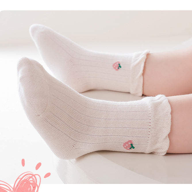 A pair of Baby Girls Frilled-Edges Breathable Mid-Calf Socks in various colors with fruit patterns, showcasing their soft fabric and frilled edges.