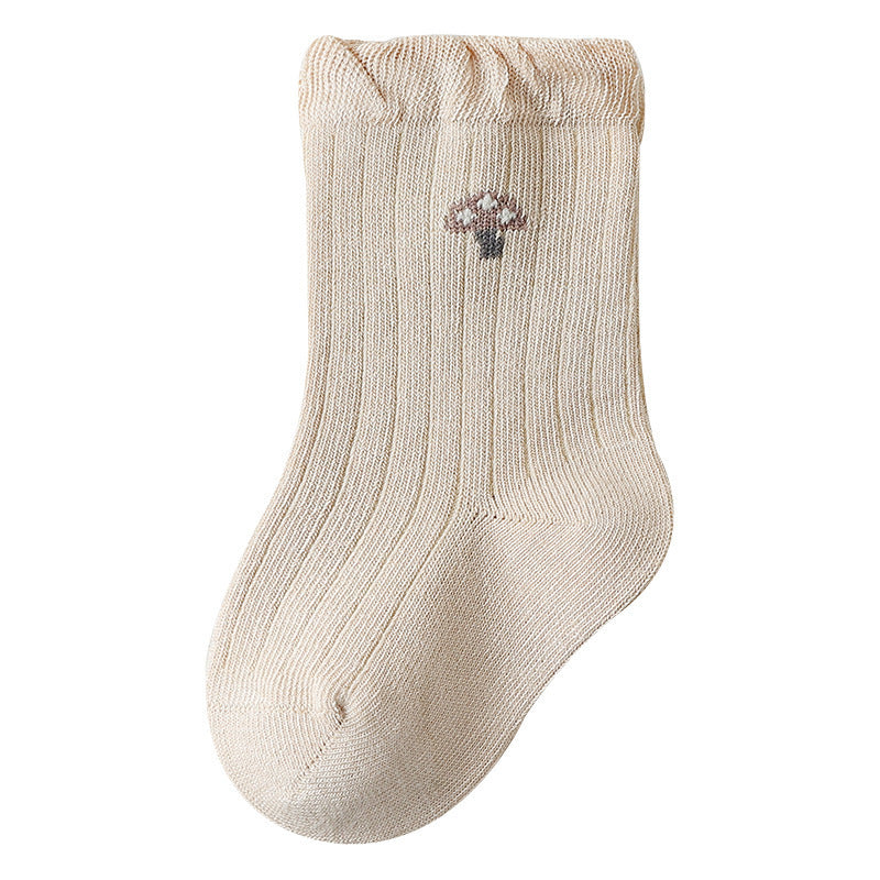 A pair of Baby Girls Frilled-Edges Breathable Mid-Calf Socks in various colors with fruit patterns, showcasing their soft fabric and frilled edges.