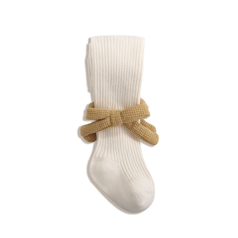 A collection of Baby Girls Kids Solid Color Striped Pattern Design Knitting Bows in white, black, grey, and khaki, showcasing their stylish design.