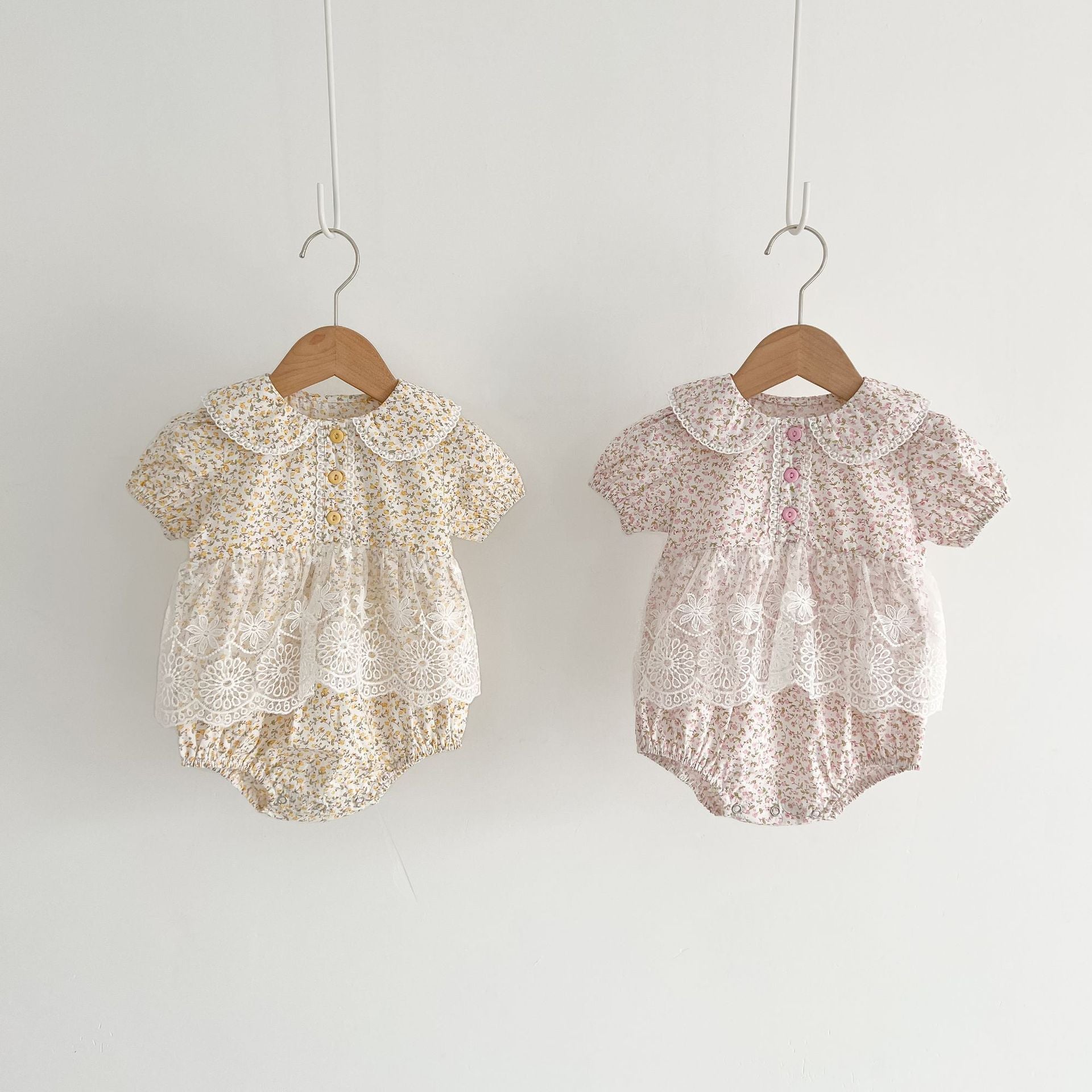 Baby girls floral print onesie featuring a doll collar and gauze skirt, available in pink and yellow.