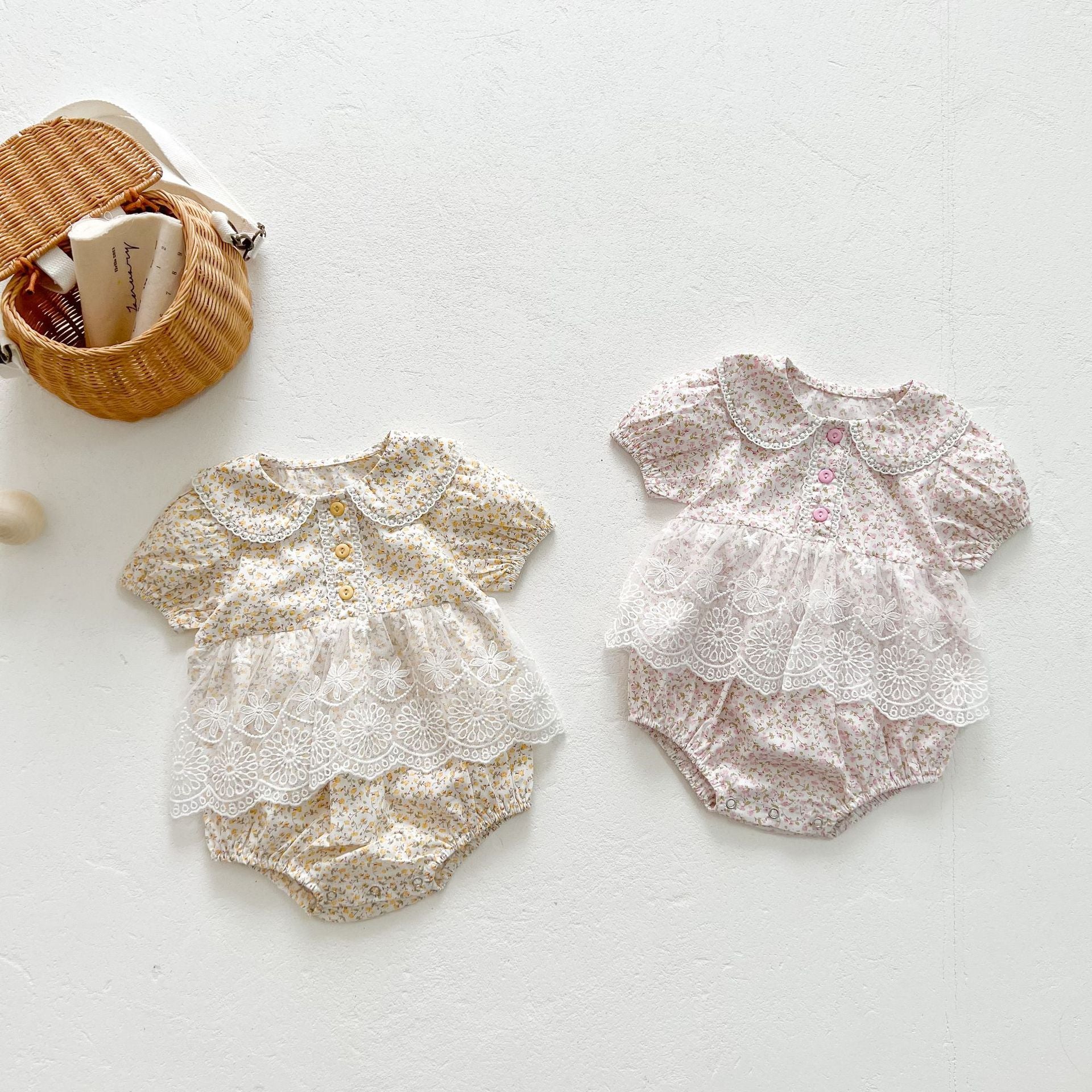 Baby girls floral print onesie featuring a doll collar and gauze skirt, available in pink and yellow.