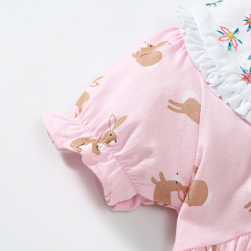 Baby girls dress featuring a Peter Pan collar, floral design, and rabbits pattern in pink cotton fabric, perfect for summer wear.