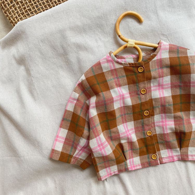 Baby girls plaid pattern t-shirt with seven point sleeves in pink, made from soft cotton material.