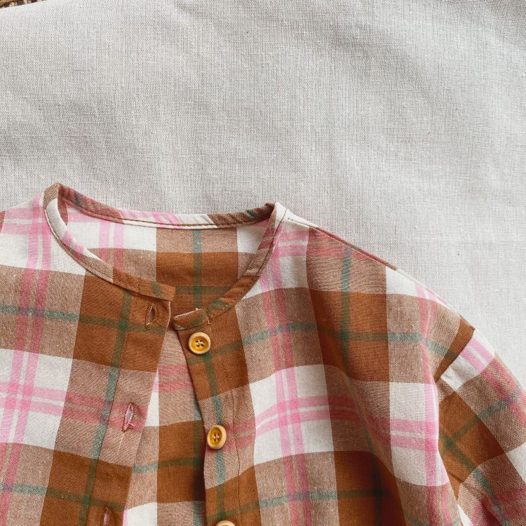 Baby girls plaid pattern t-shirt with seven point sleeves in pink, made from soft cotton material.